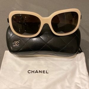Chanel sunglasses in cream and black with little bows on sides